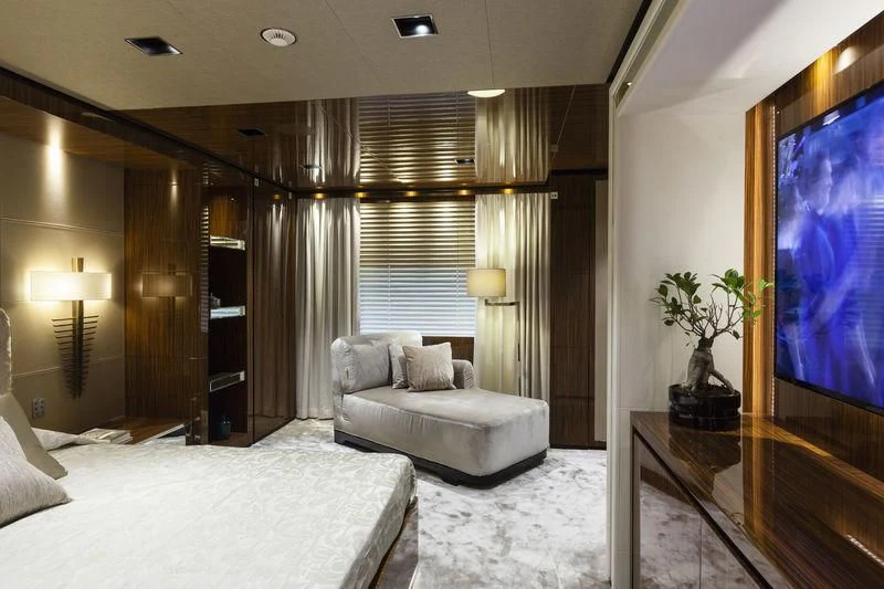 a room with a bed and a tv aboard MEDIALLY Yacht for Sale