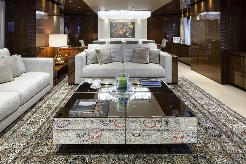 a living room with a large coffee table and a couch aboard MEDIALLY Yacht for Sale