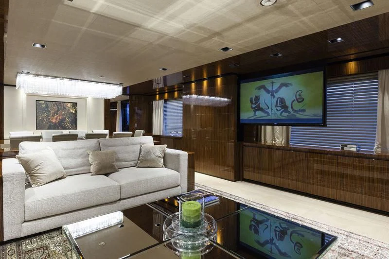 a living room with a large mirror aboard MEDIALLY Yacht for Sale