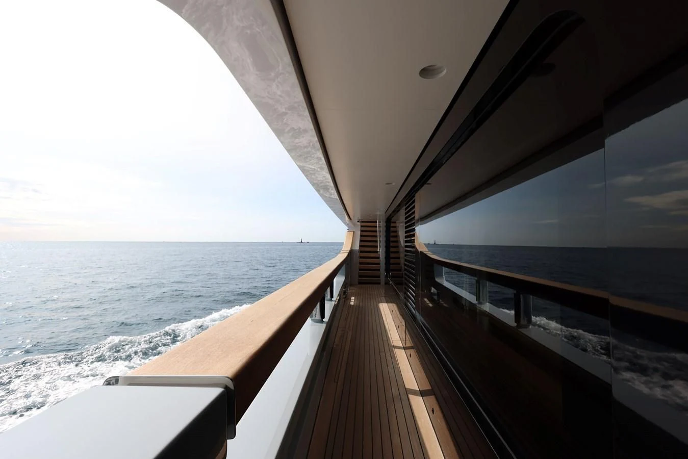 a wooden walkway on a beach aboard MEDIALLY Yacht for Sale