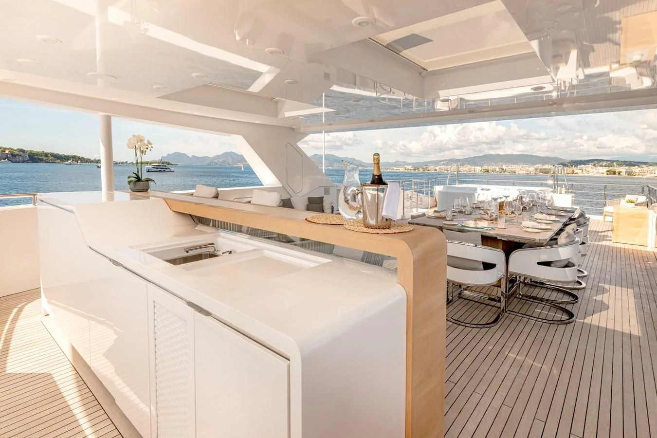 a room with a table and chairs aboard MEDIALLY Yacht for Sale