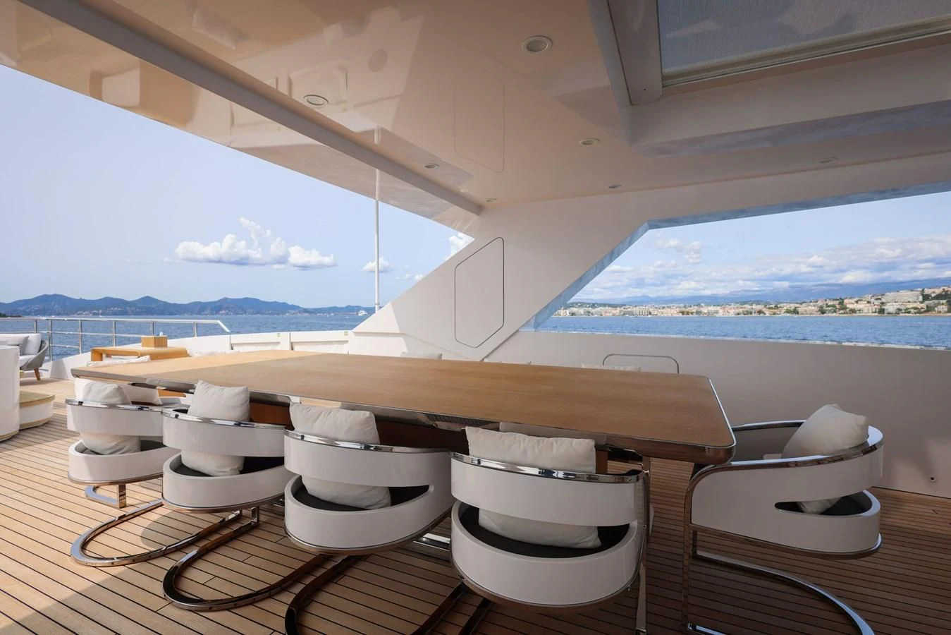 a room with a table and chairs aboard MEDIALLY Yacht for Sale