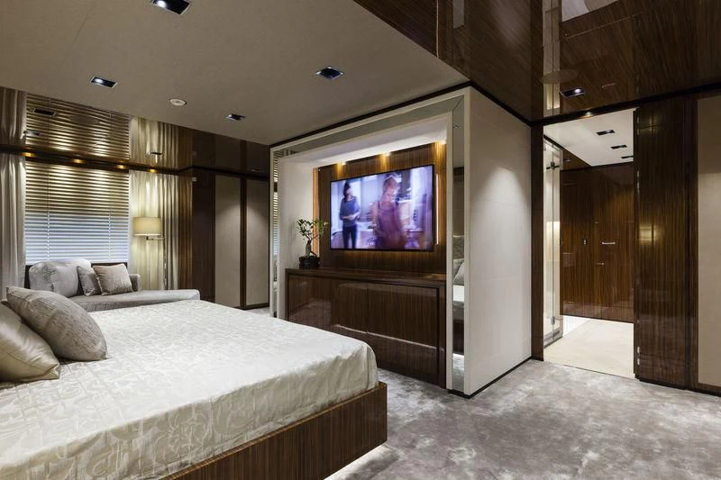 a hotel room with a bed and tv aboard MEDIALLY Yacht for Sale