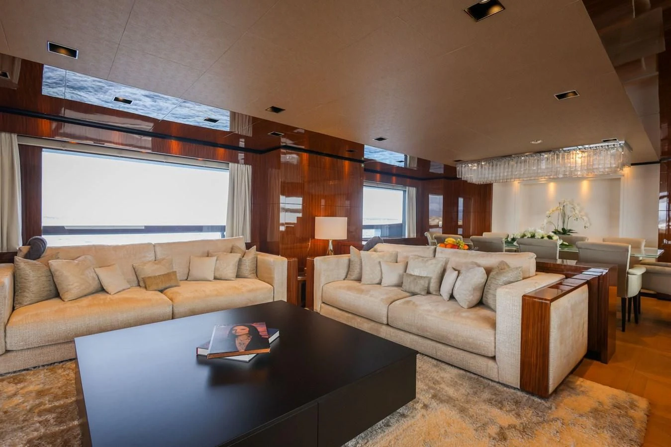 a living room with a large window aboard MEDIALLY Yacht for Sale