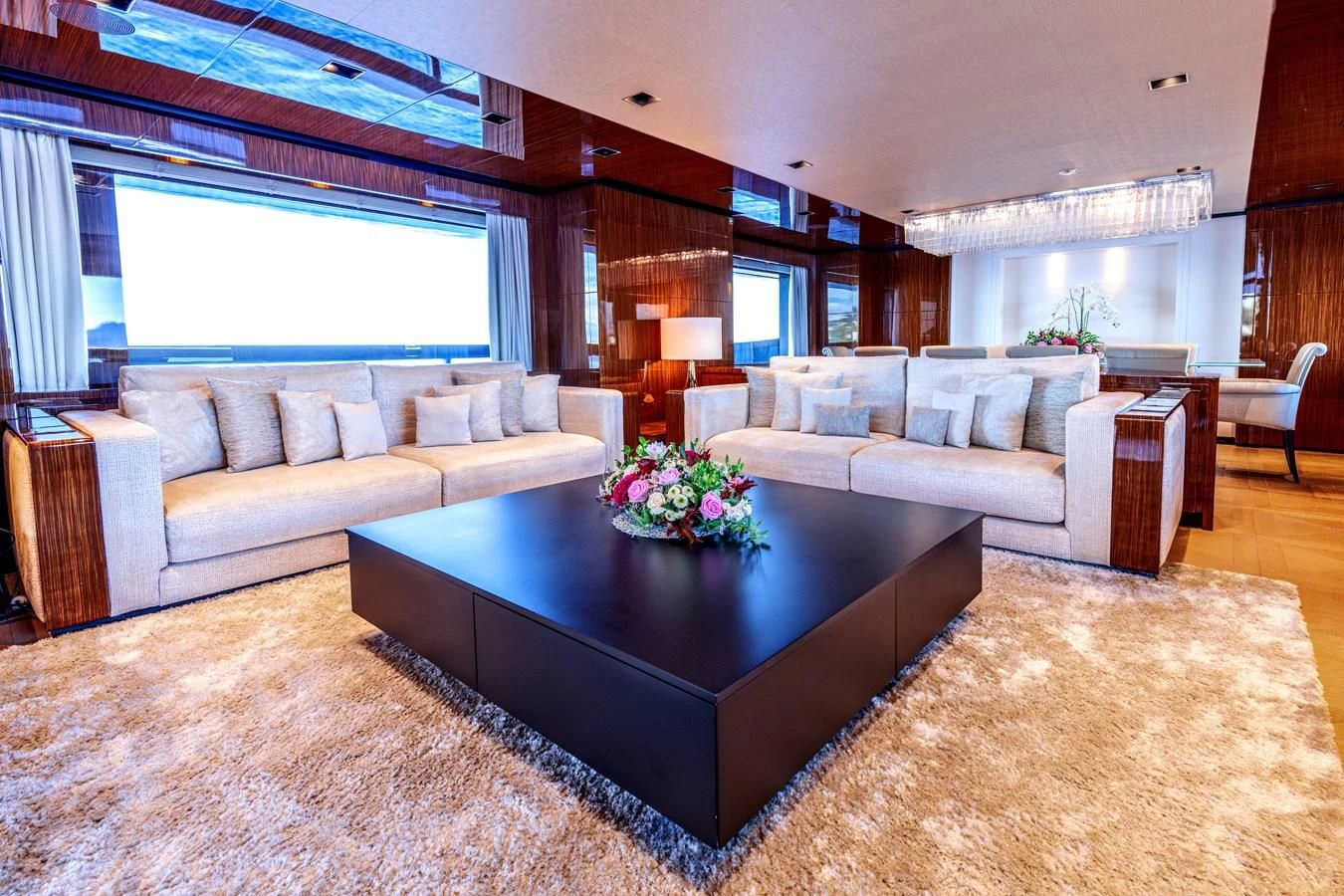 a living room with a large sofa aboard MEDIALLY Yacht for Sale