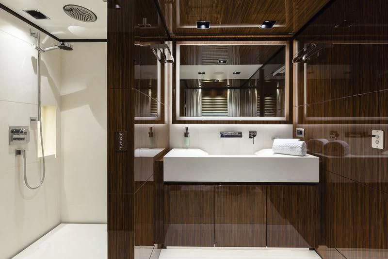 a bathroom with a sink and a mirror aboard MEDIALLY Yacht for Sale