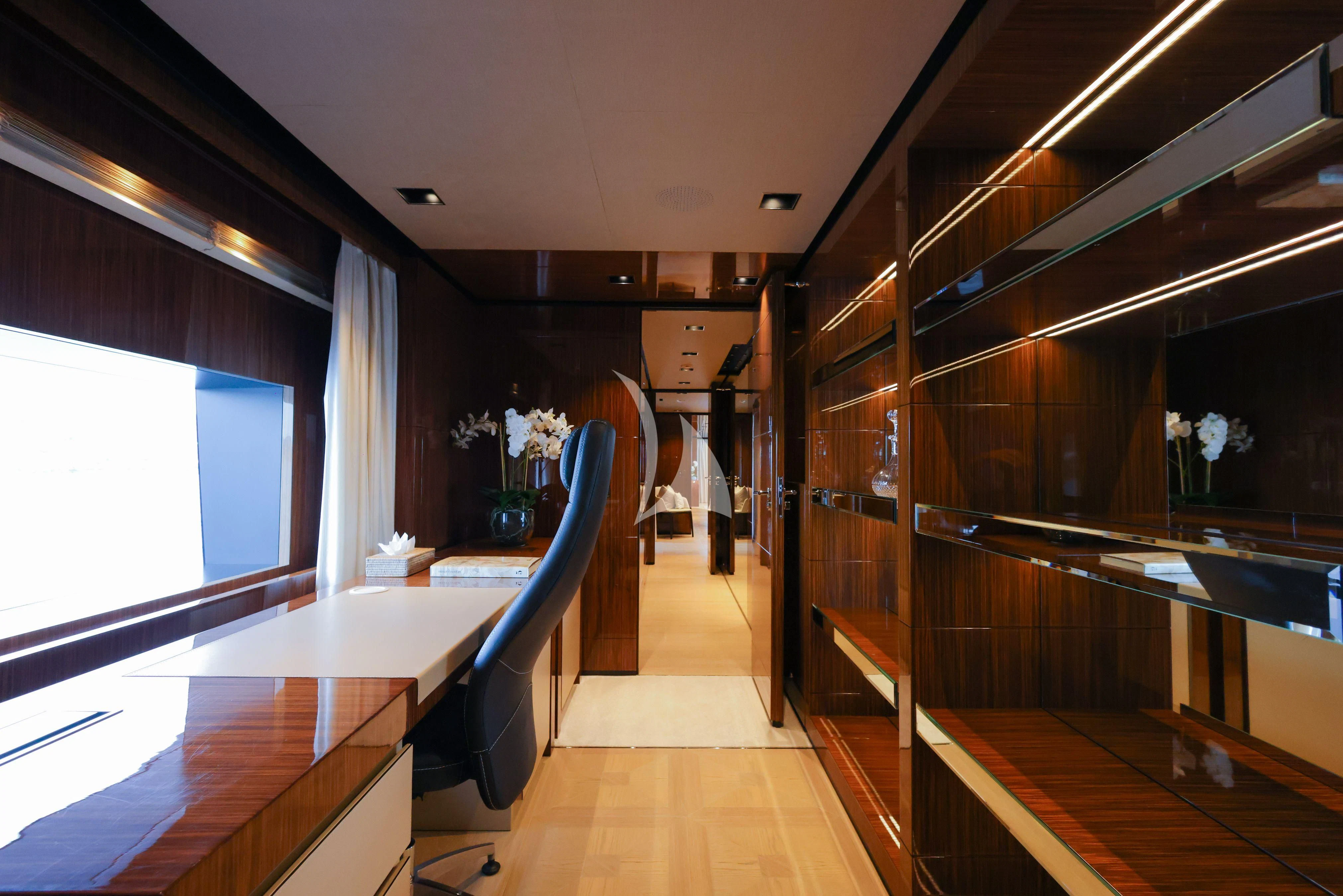 a room with wood floors and a wood wall with a wood railing aboard MEDIALLY Yacht for Sale