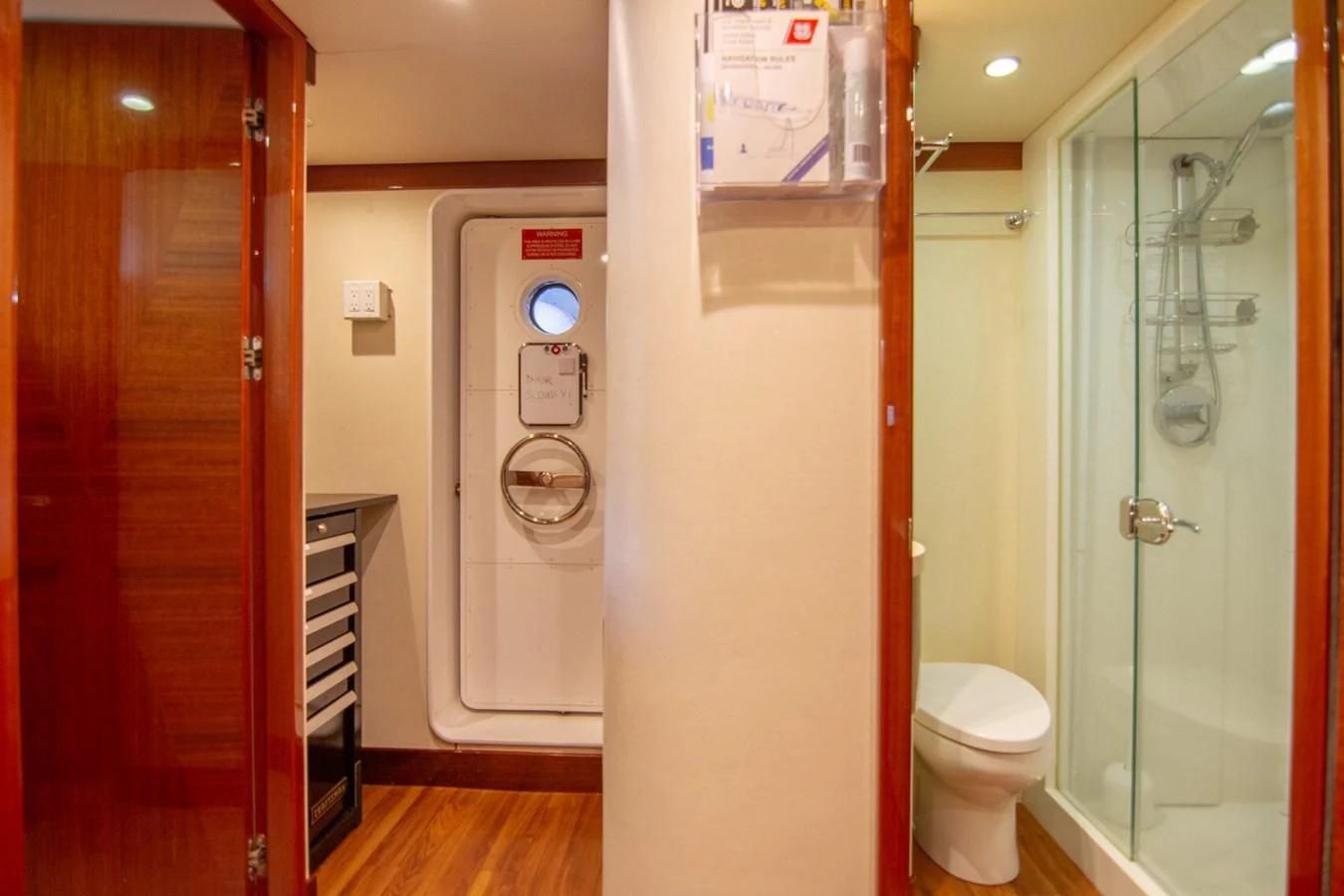 a bathroom with a shower and a toilet aboard BRAVO Yacht for Sale
