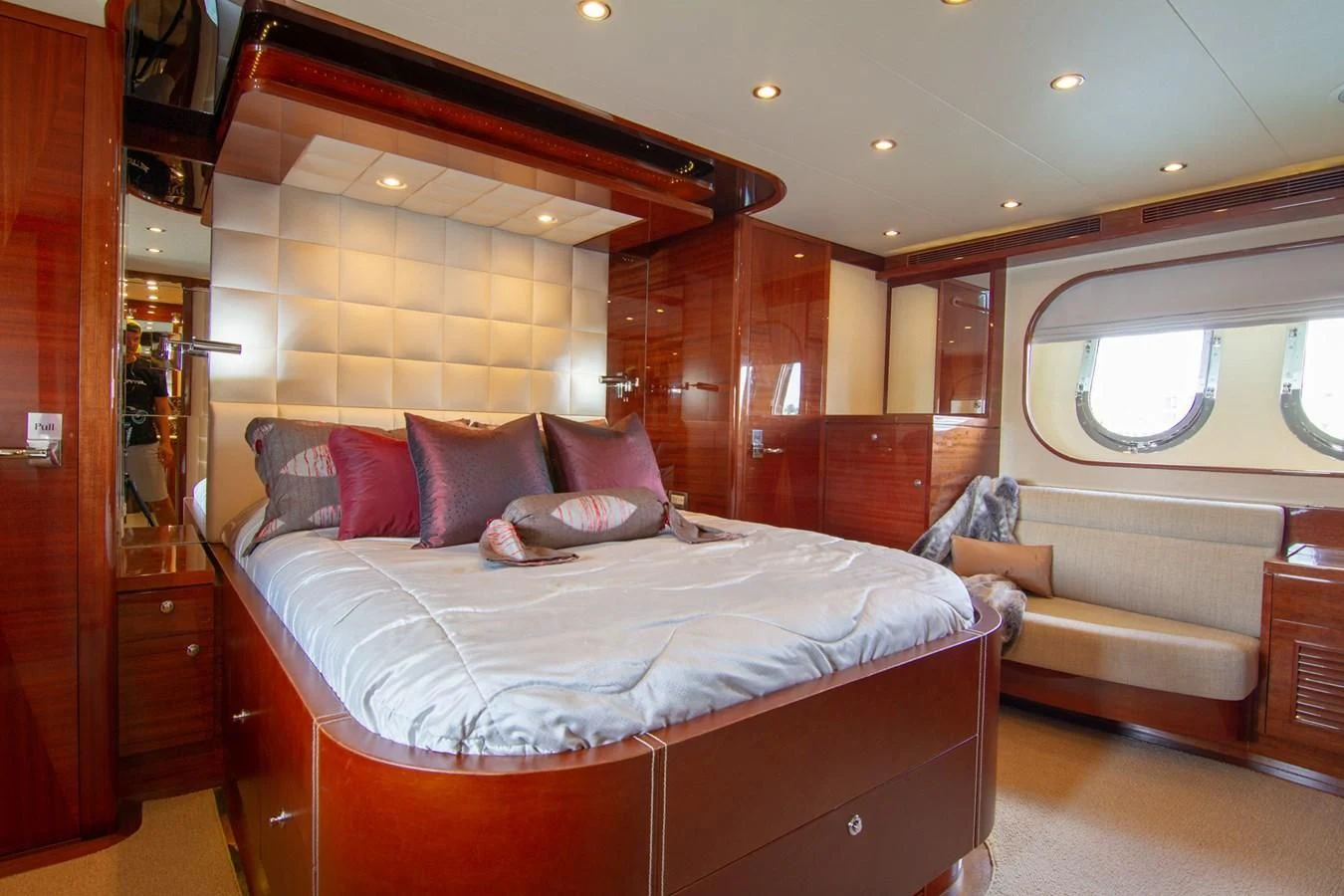 a person lying on a bed aboard BRAVO Yacht for Sale