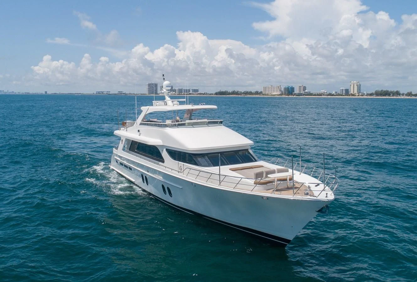 a white yacht in the water aboard BRAVO Yacht for Sale