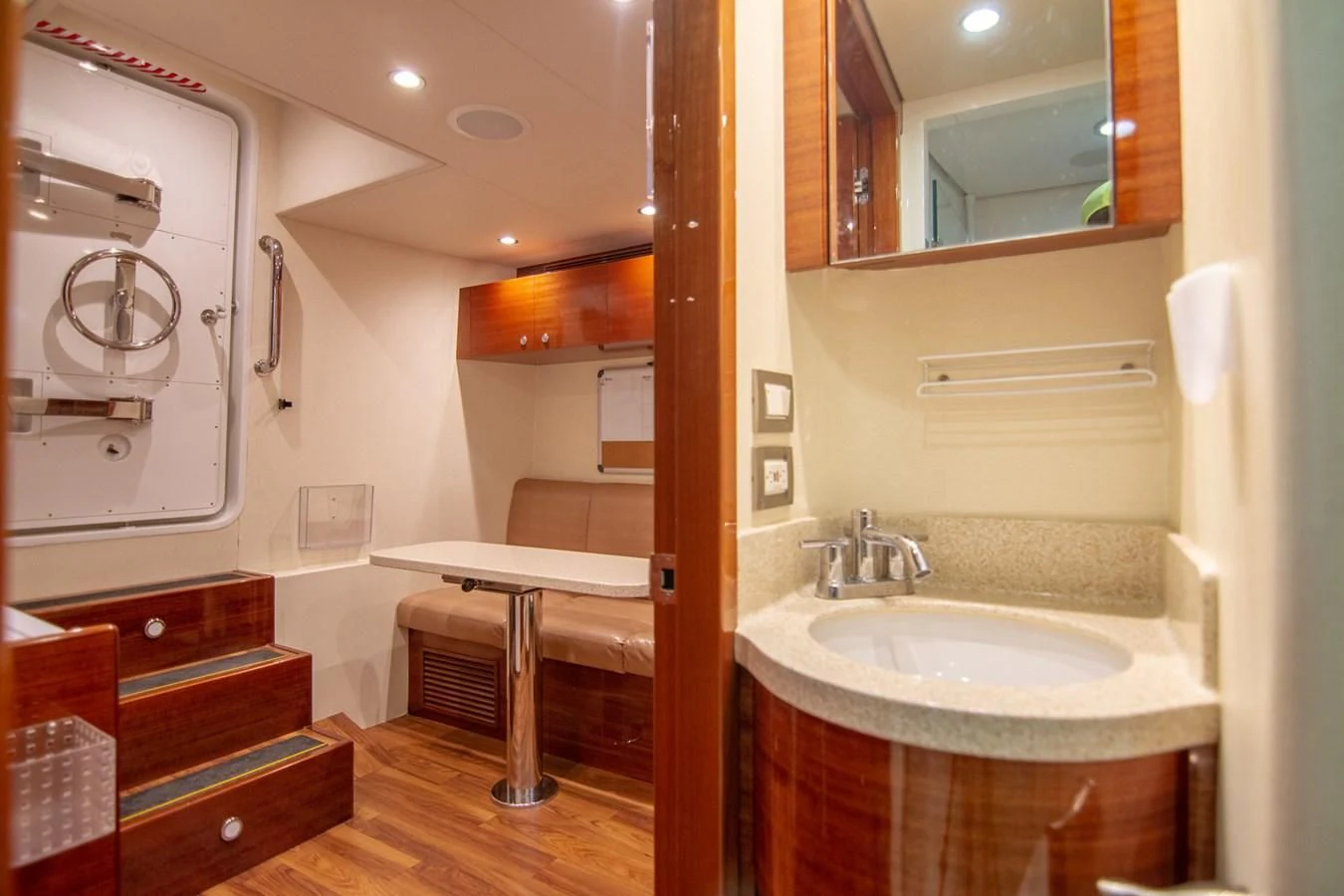 a bathroom with a sink and a mirror aboard BRAVO Yacht for Sale