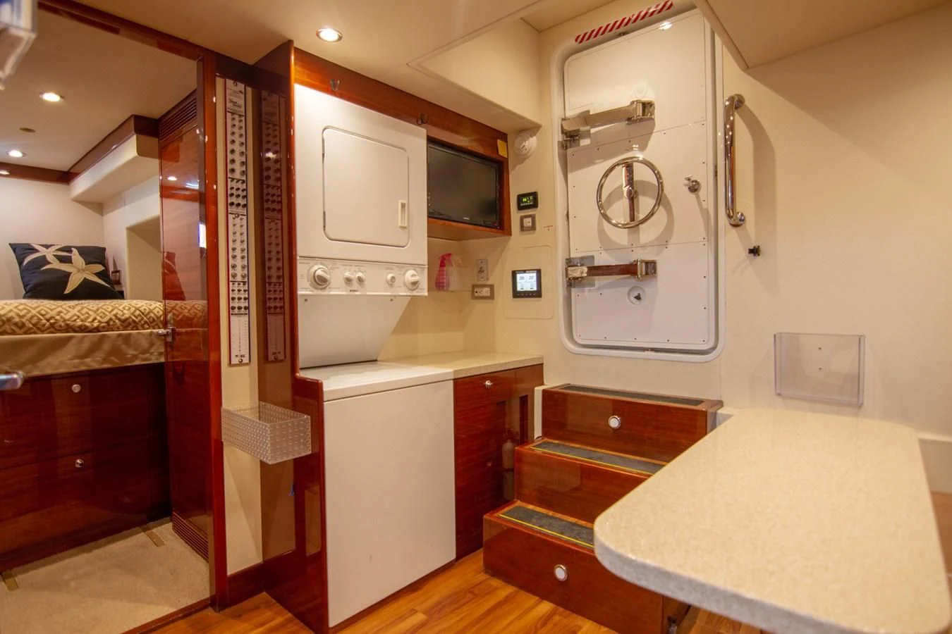 a kitchen with a microwave oven and cabinets aboard BRAVO Yacht for Sale