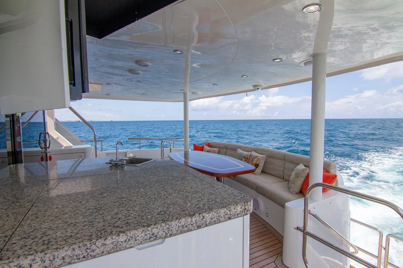 a large white table on a boat aboard BRAVO Yacht for Sale