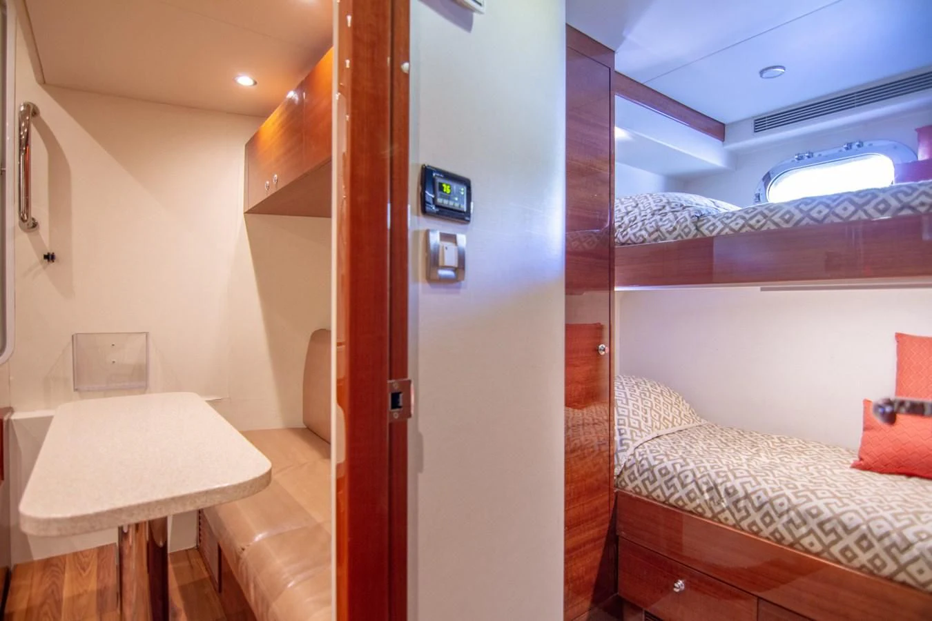 a room with a bed and a table aboard BRAVO Yacht for Sale
