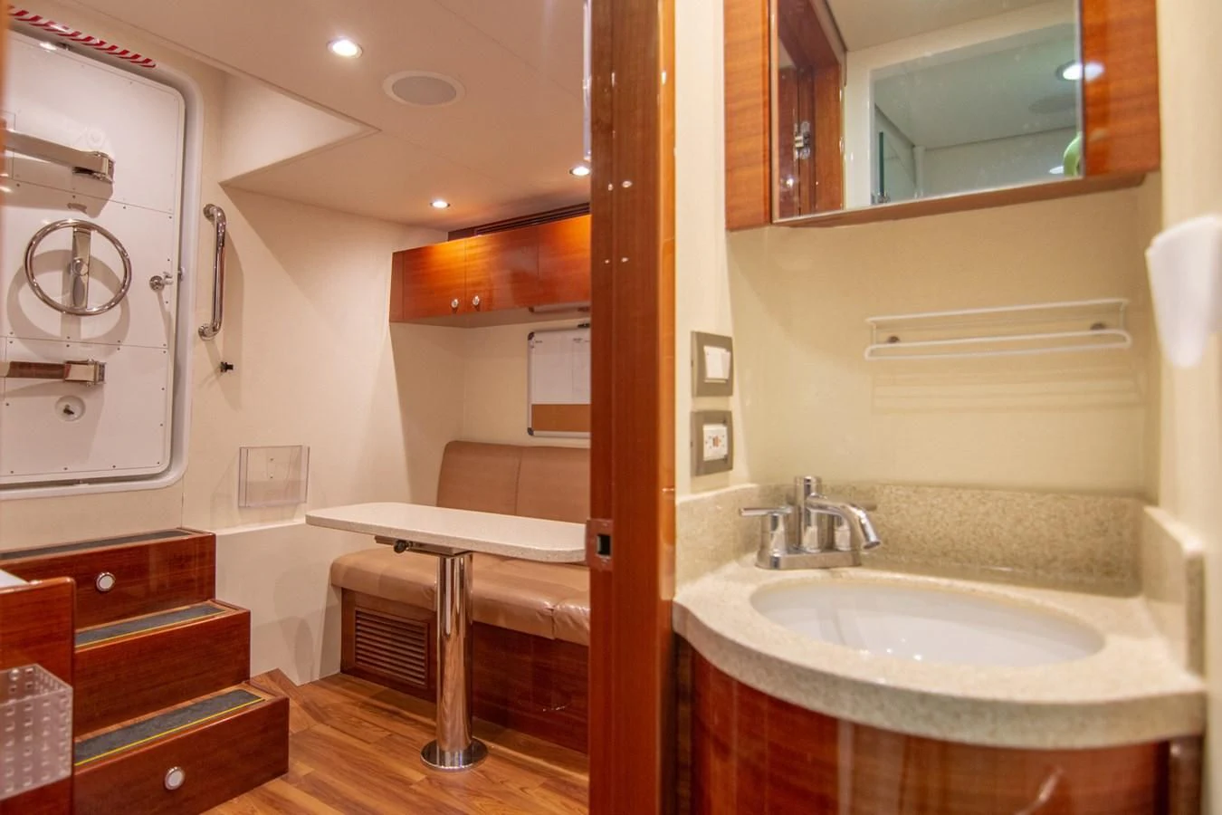 a bathroom with a sink and a mirror aboard BRAVO Yacht for Sale