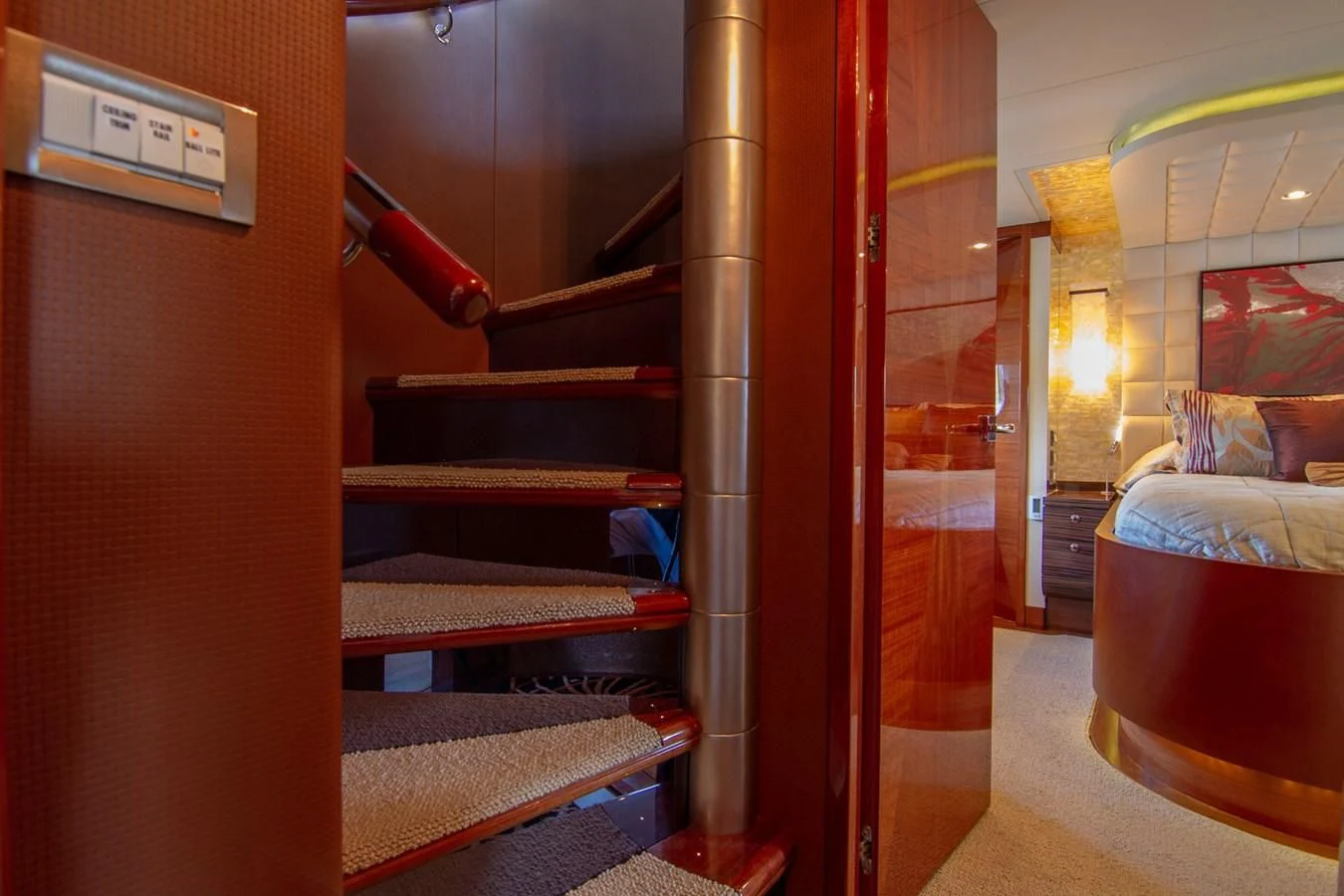 a room with a bed and a red wall aboard BRAVO Yacht for Sale