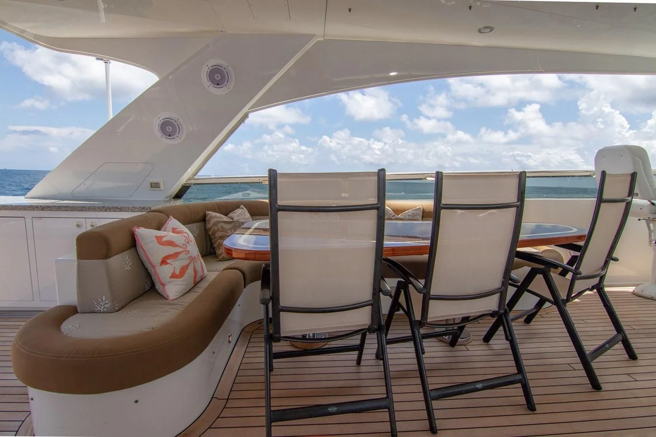 a room with chairs and a table aboard BRAVO Yacht for Sale