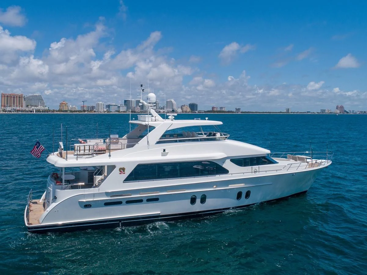 a large white yacht in the water aboard BRAVO Yacht for Sale