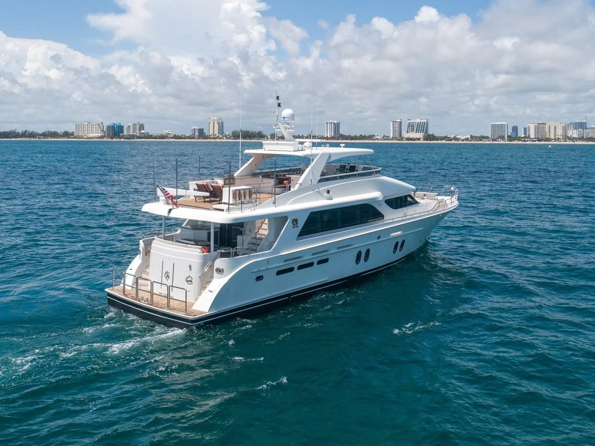 a white boat in the water aboard BRAVO Yacht for Sale