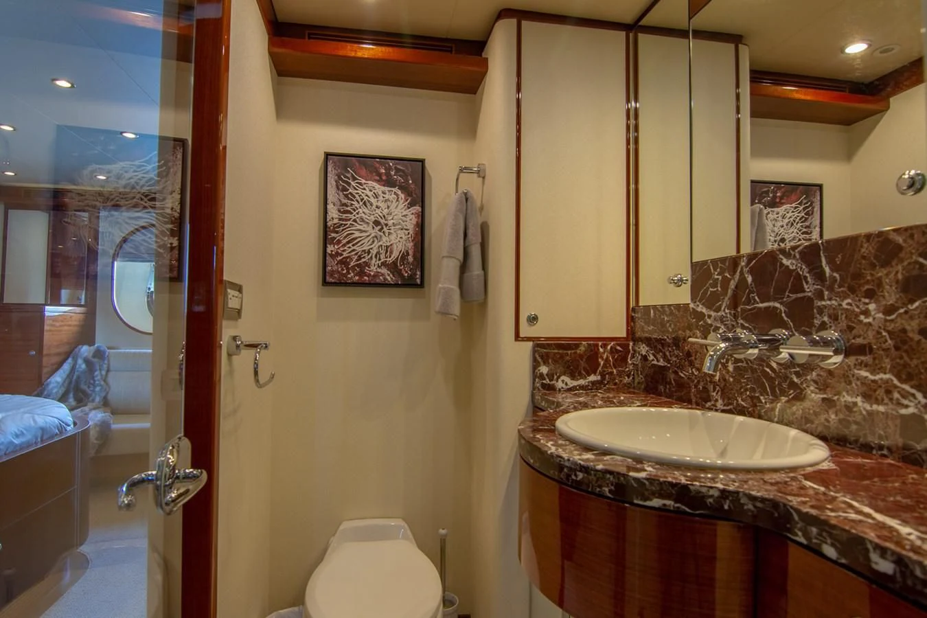 a bathroom with a sink and a mirror aboard BRAVO Yacht for Sale