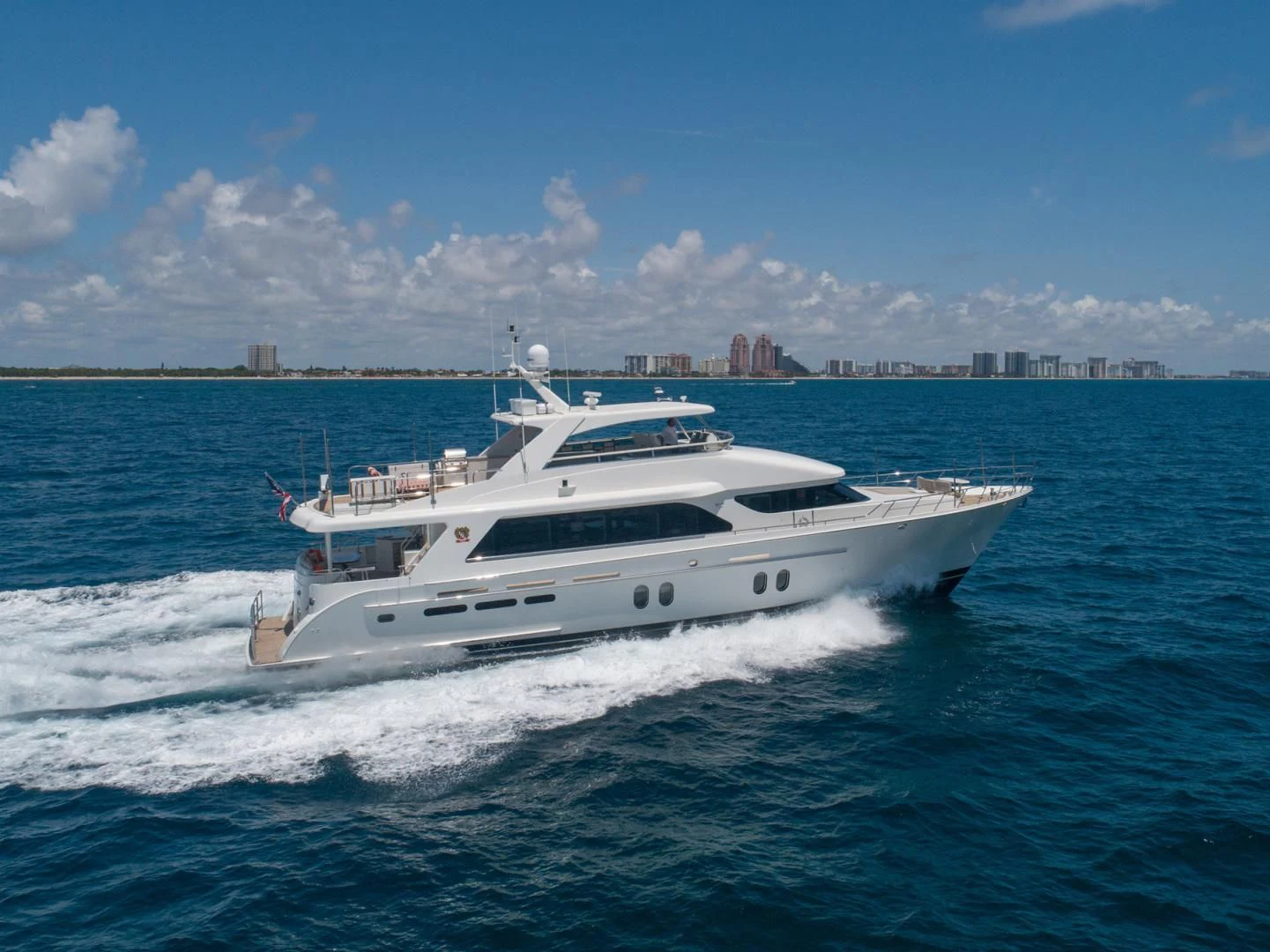 a white yacht on the water aboard BRAVO Yacht for Sale