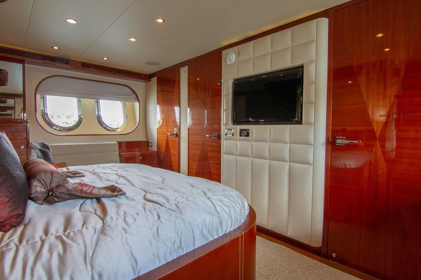 a bed in a room aboard BRAVO Yacht for Sale