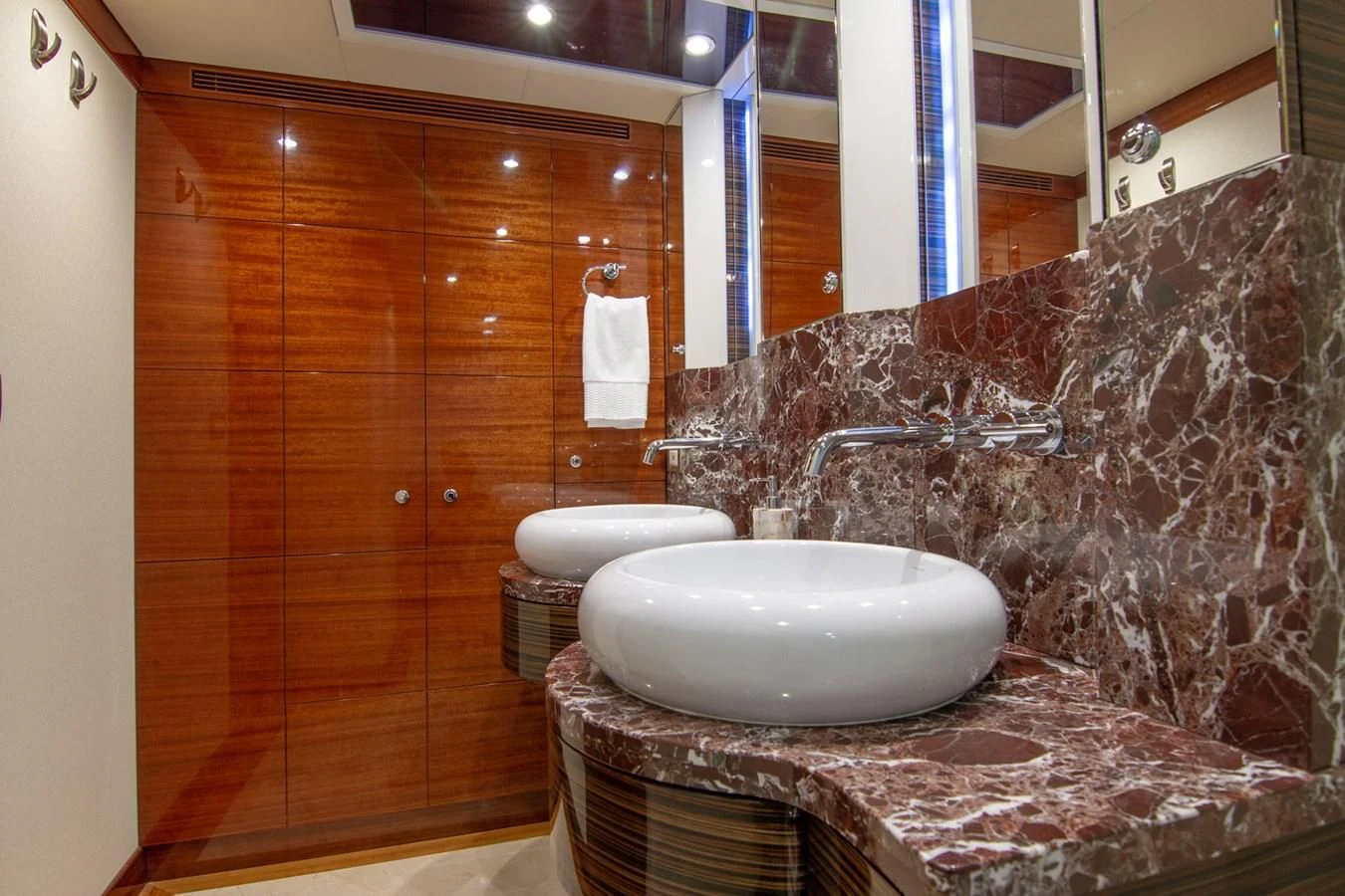 a bathroom with a marble counter top aboard BRAVO Yacht for Sale