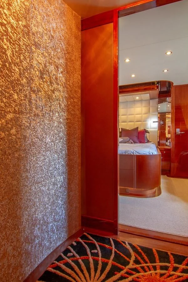 a large mirror behind a bed aboard BRAVO Yacht for Sale