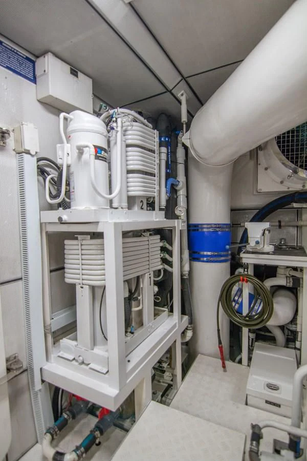 a white machine with blue and red lights aboard BRAVO Yacht for Sale