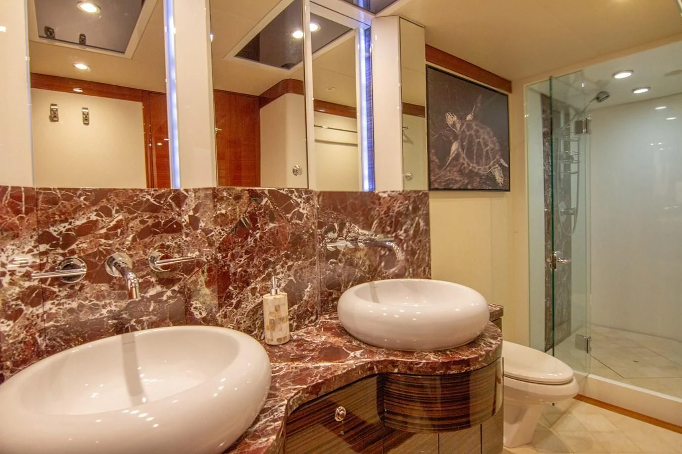 a bathroom with a marble counter top aboard BRAVO Yacht for Sale