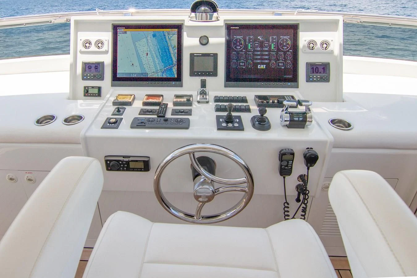 a white boat with buttons and a round display on the front aboard BRAVO Yacht for Sale