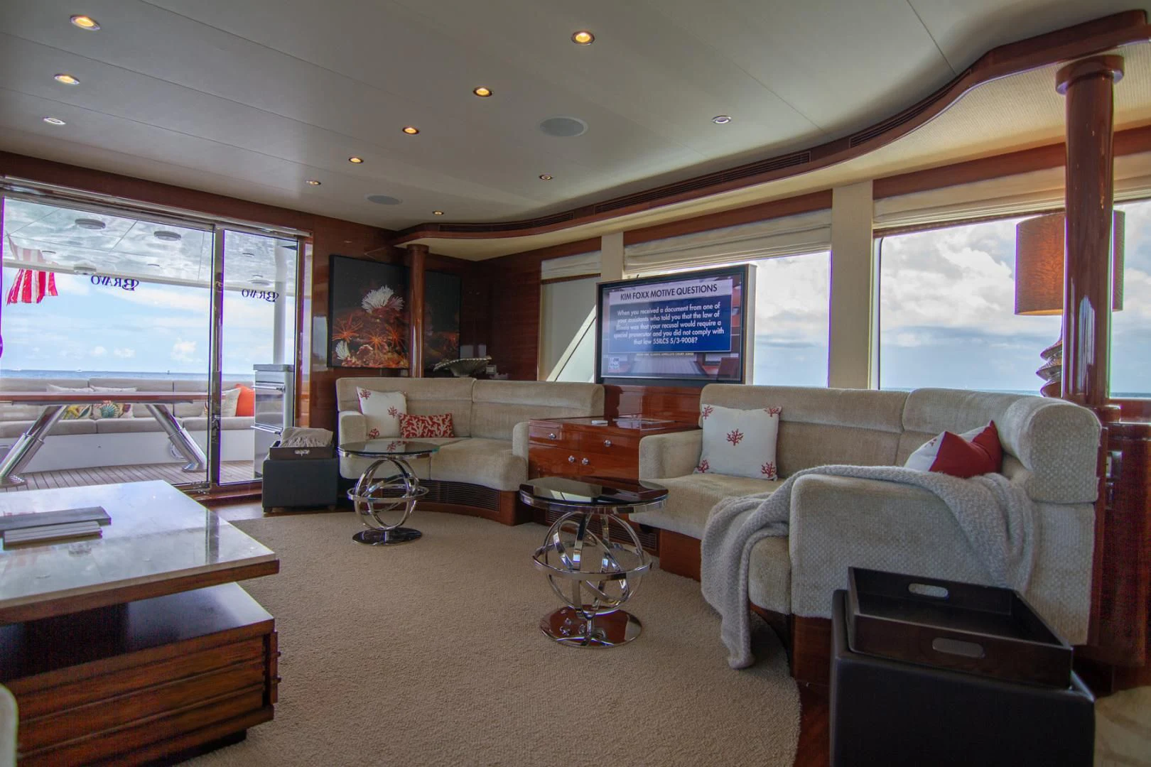 a living room with a large window aboard BRAVO Yacht for Sale