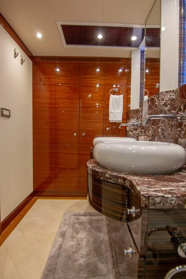 a bathroom with a large sink aboard BRAVO Yacht for Sale