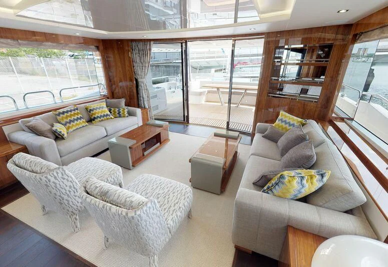 a living room with a large glass door aboard SEA WATER II Yacht for Sale