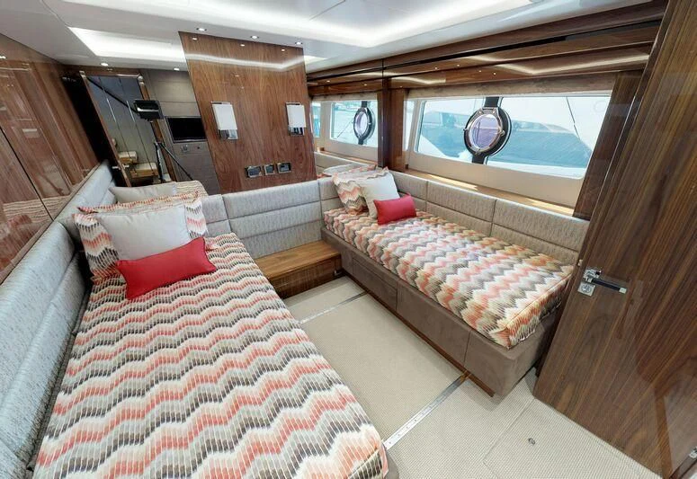 a cabin with a bed and a couch aboard SEA WATER II Yacht for Sale