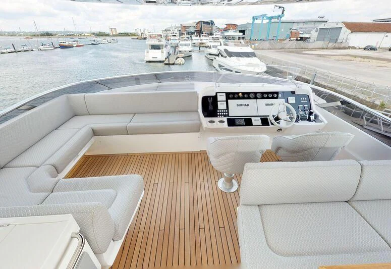 a deck with a deck and a view of a city aboard SEA WATER II Yacht for Sale
