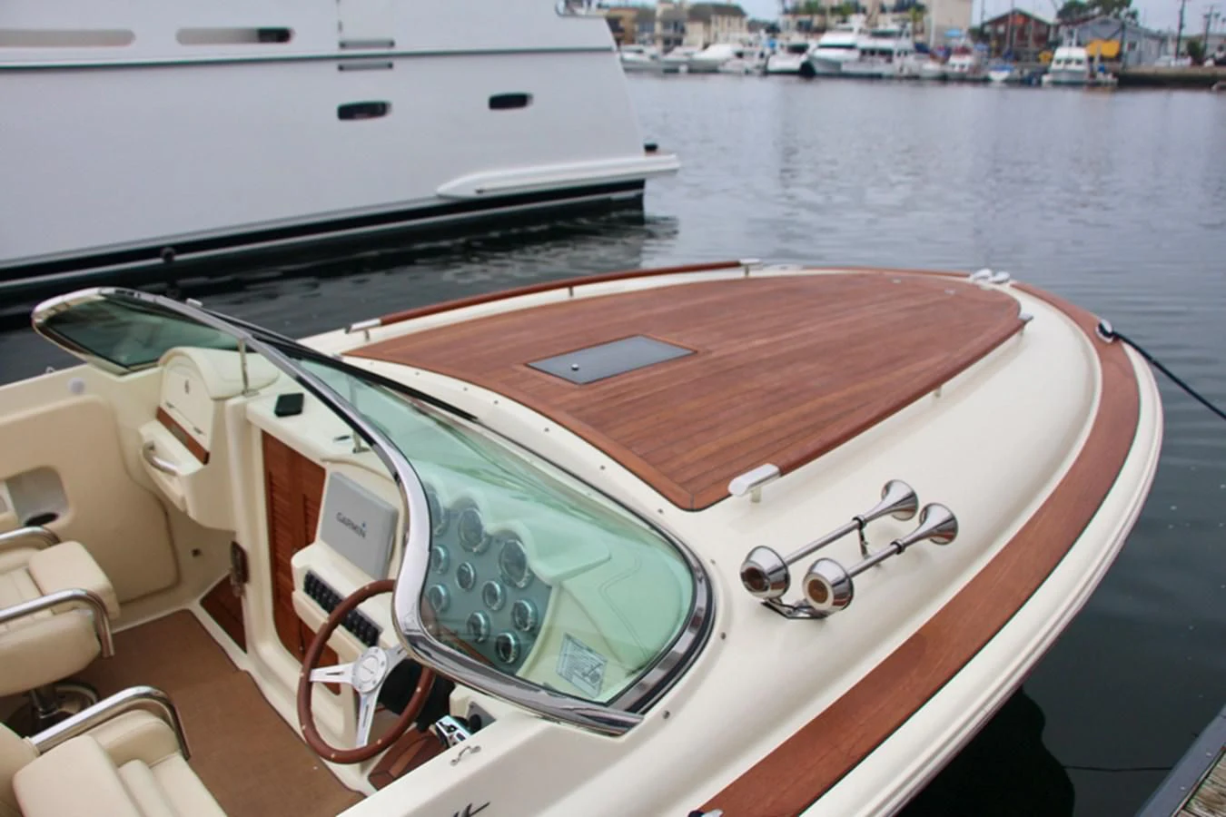 a boat with a wooden deck aboard CHRIS CRAFT 28 Yacht for Sale