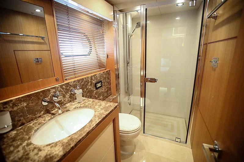 a bathroom with a sink and a shower aboard SUN GOLD Yacht for Sale