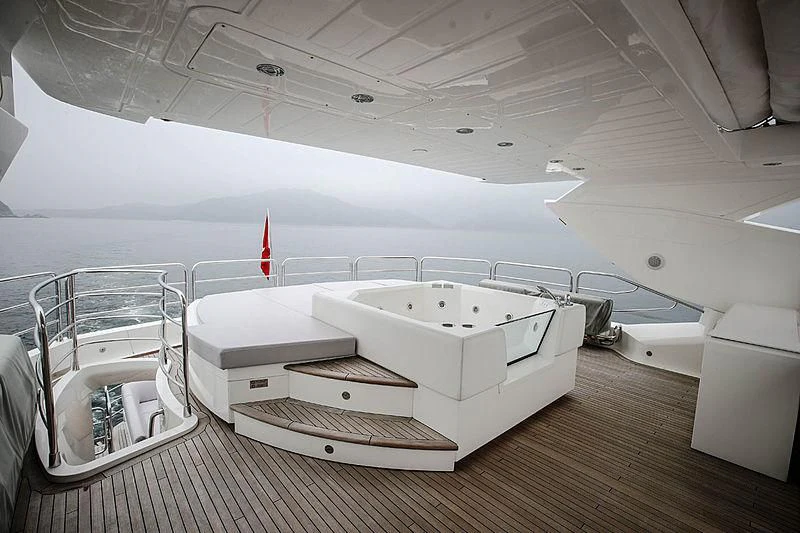 a room with a couple of white beds and a red line on the ceiling aboard SUN GOLD Yacht for Sale