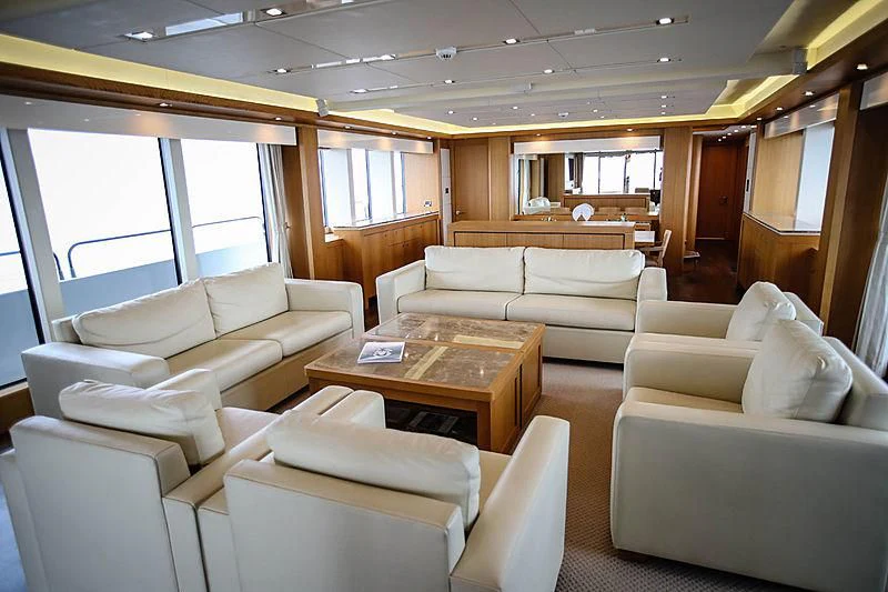 a living room with white couches aboard SUN GOLD Yacht for Sale