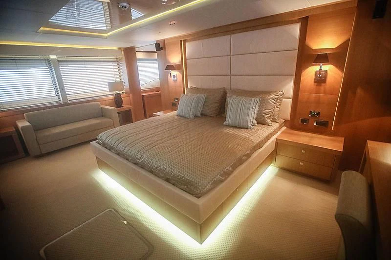 a bed in a room aboard SUN GOLD Yacht for Sale