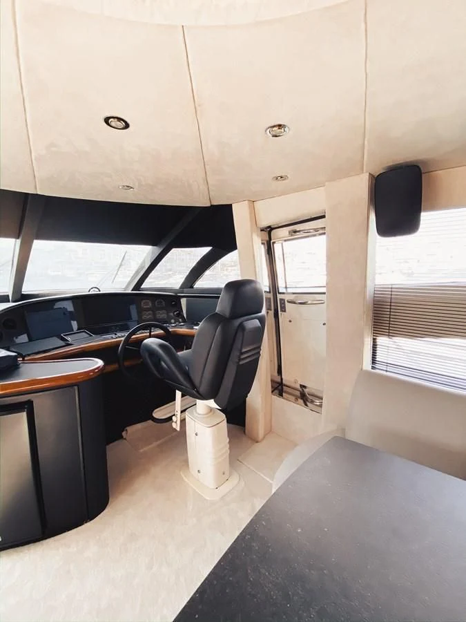a room with a desk and a chair aboard HELENA Yacht for Sale