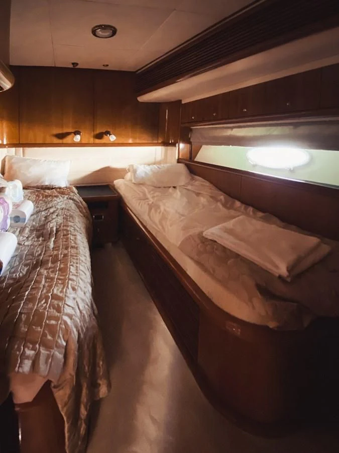 a bed in a room aboard HELENA Yacht for Sale