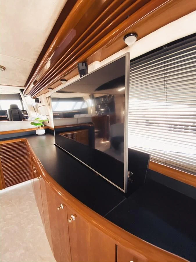a kitchen with a black counter aboard HELENA Yacht for Sale