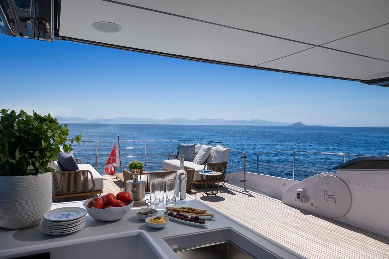 a table with food on it aboard SPICA Yacht for Sale