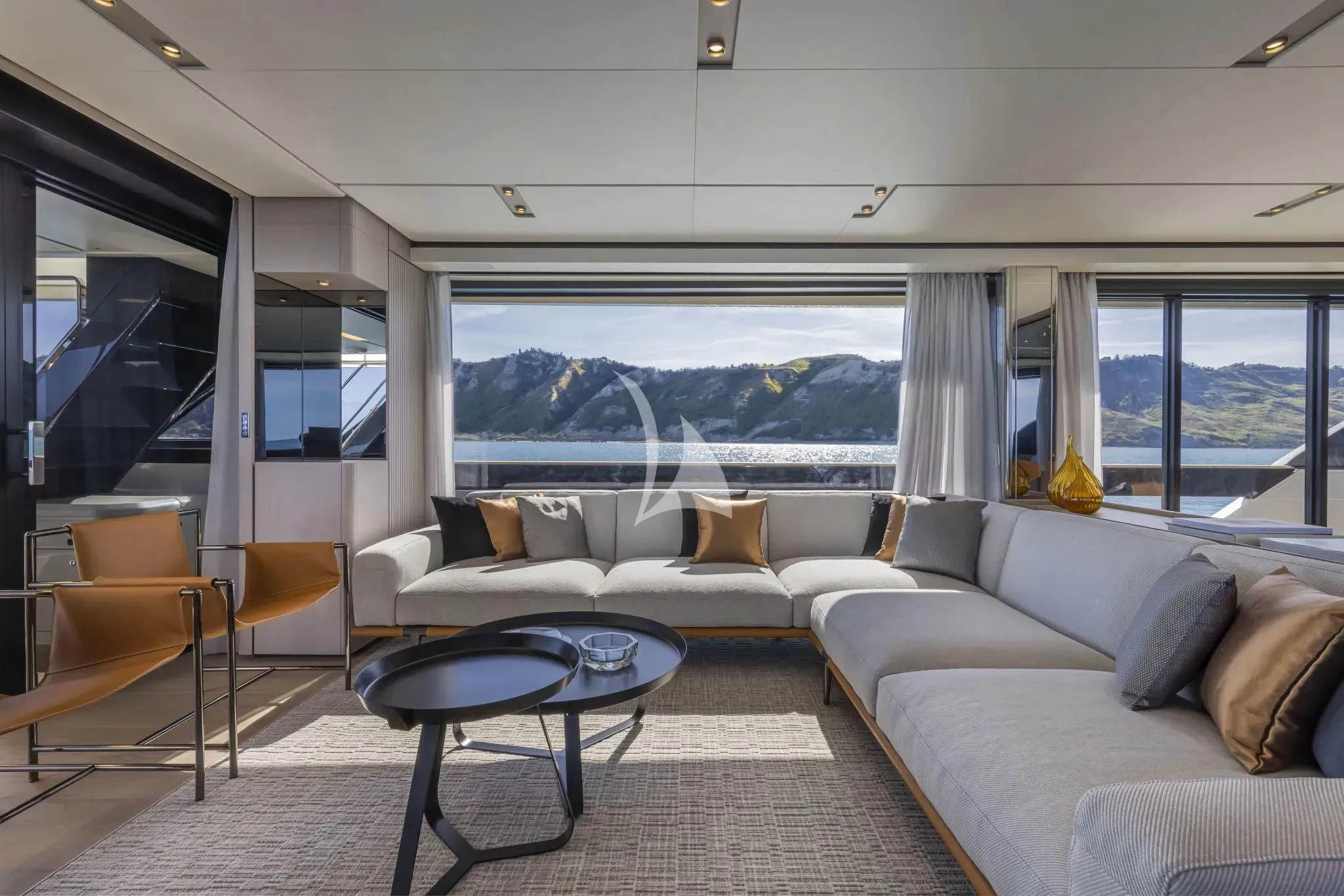 a living room with a large window aboard SPICA Yacht for Sale