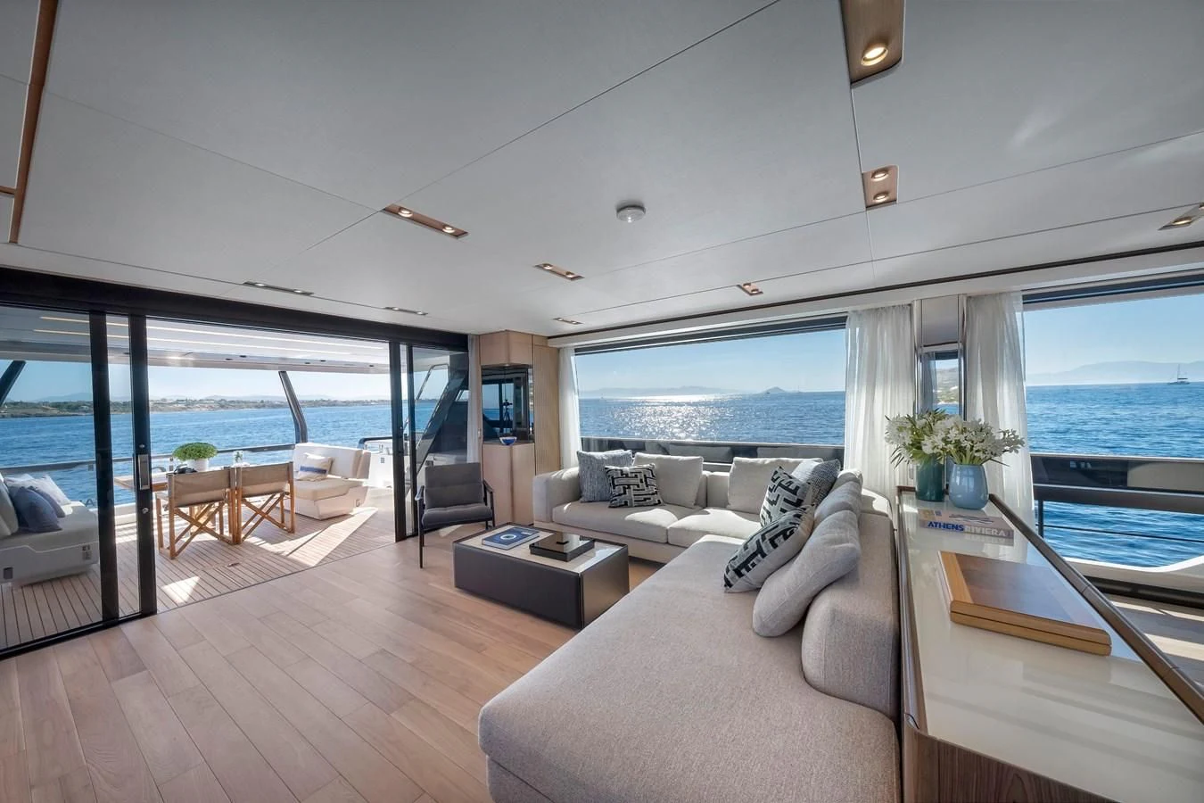 a living room with a large window aboard SPICA Yacht for Sale