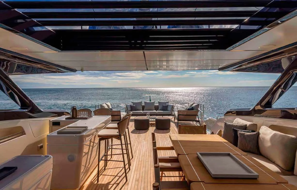 a deck with a view of the ocean and a deck aboard SPICA Yacht for Sale