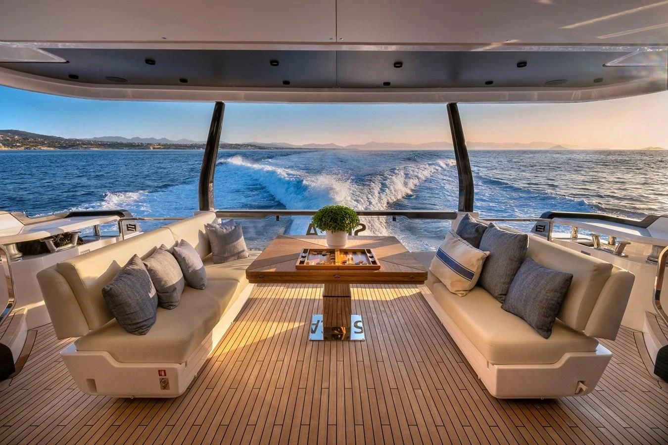 a couch and a table on a boat aboard SPICA Yacht for Sale