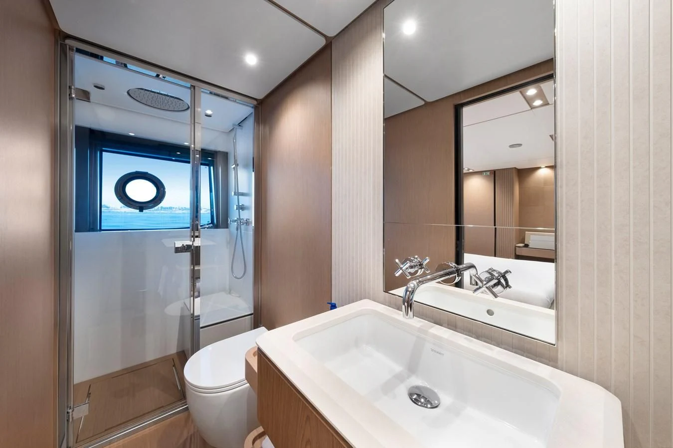 a bathroom with a large mirror aboard SPICA Yacht for Sale